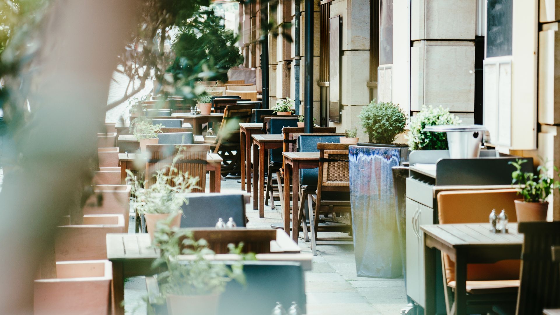 A dining terrace displaying the certified partner badge — a real-world partner location