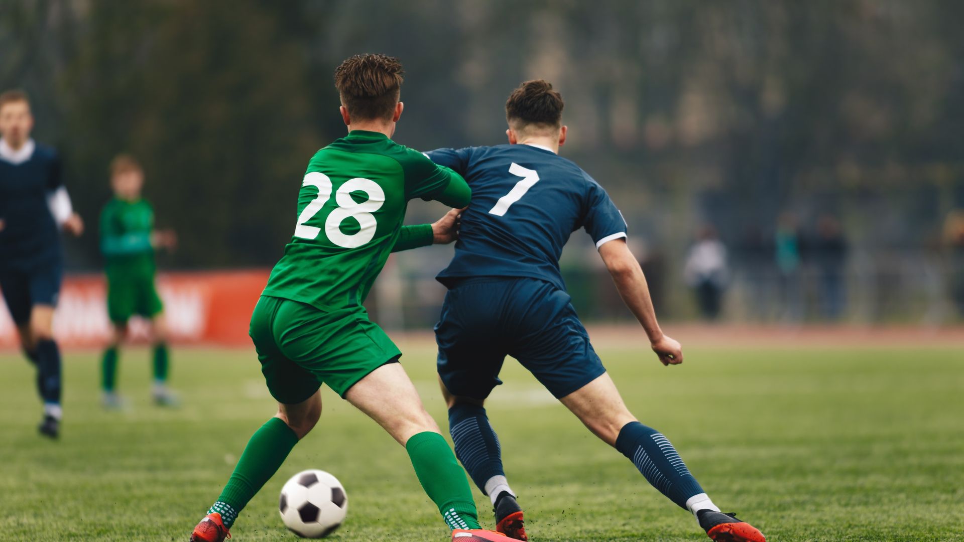 Soccer players in action during a competitive match